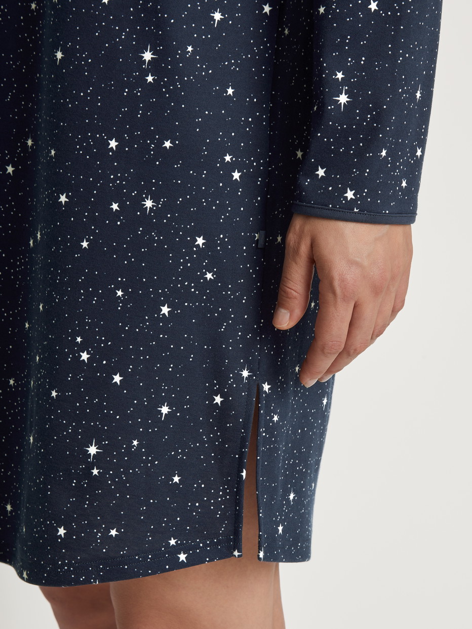 Women model is wearing Long Sleeve Nightdress – 95 cm Length made of 100% Cotton in Blue, Motif from the Sweet Dreams series by CALIDA, Detail