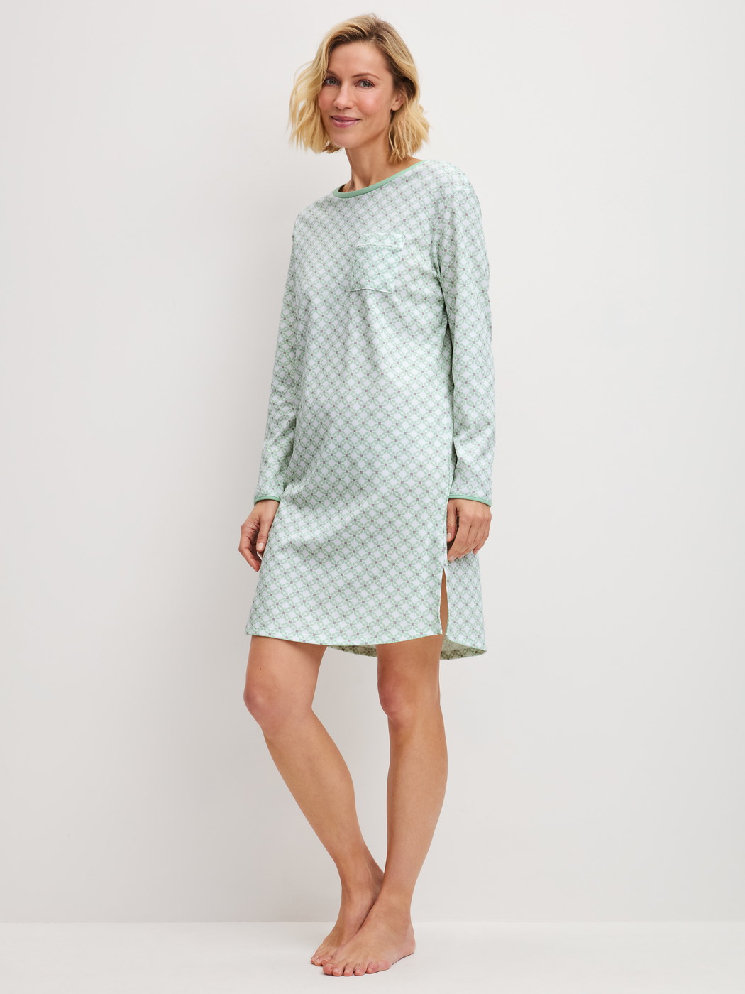 Women model is wearing Long Sleeve Nightdress – 95 cm Length made of 100% Cotton in Turquoise, Patterned from the Sweet Dreams series by CALIDA, Front view