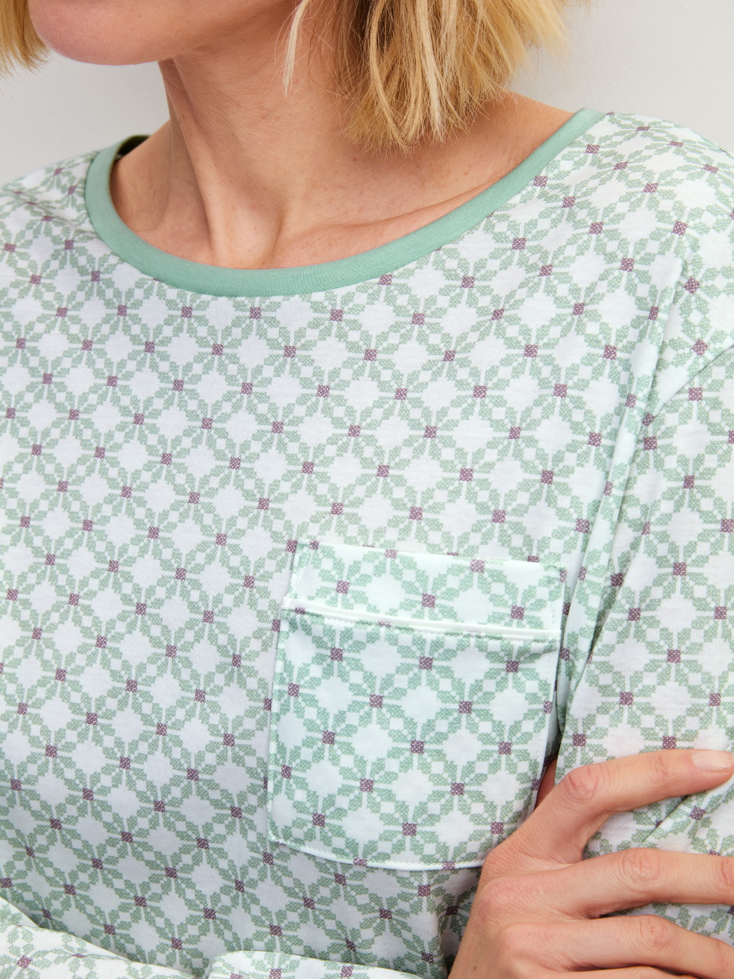 Women model is wearing Long Sleeve Nightdress – 95 cm Length made of 100% Cotton in Turquoise, Patterned from the Sweet Dreams series by CALIDA, Detail