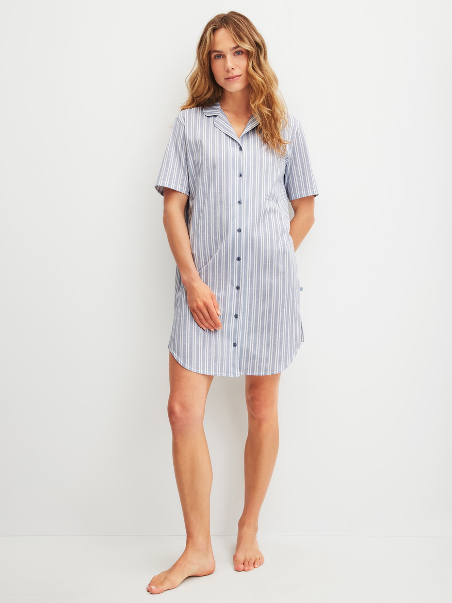 Women model is wearing Short-sleeved nightdress with buttons, length 95 cm made of 100% Cotton in Blue, Striped from the Striped Dreams series by CALIDA, Front view