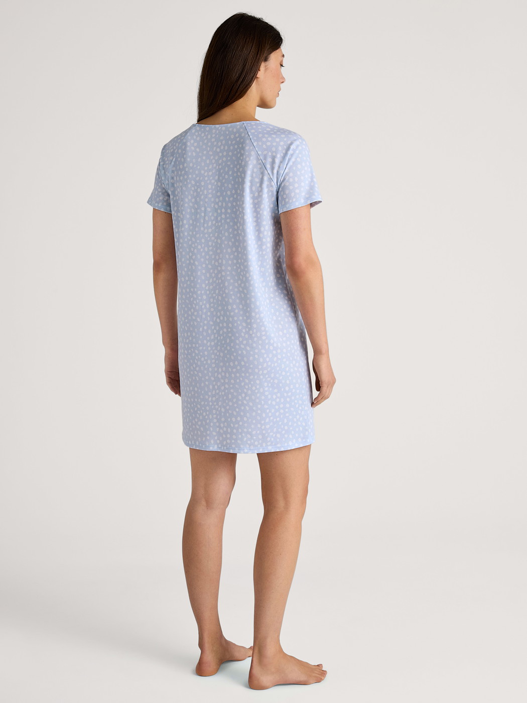 Women model is wearing Sleepshirt, length 90cm made of 100% Cotton in Blue, Patterned from the Favourites Sleep series by CALIDA, Back view