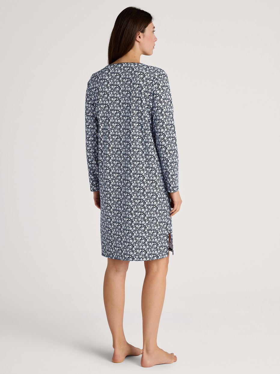 Women model is wearing Long Sleeve Nightdress – 100 cm Length made of 100% Cotton in Blue, Floral from the Favourites Sleep series by CALIDA, Back view