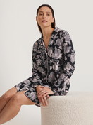 Women model is wearing Long Sleeve Nightdress in TENCEL™ Modal and Silk made of Modal in Black, Floral from the Moonlight Dreams series by CALIDA, Front view
