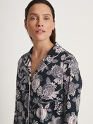 Women model is wearing Long Sleeve Nightdress in TENCEL™ Modal and Silk made of Modal in Black, Floral from the Moonlight Dreams series by CALIDA, Detail