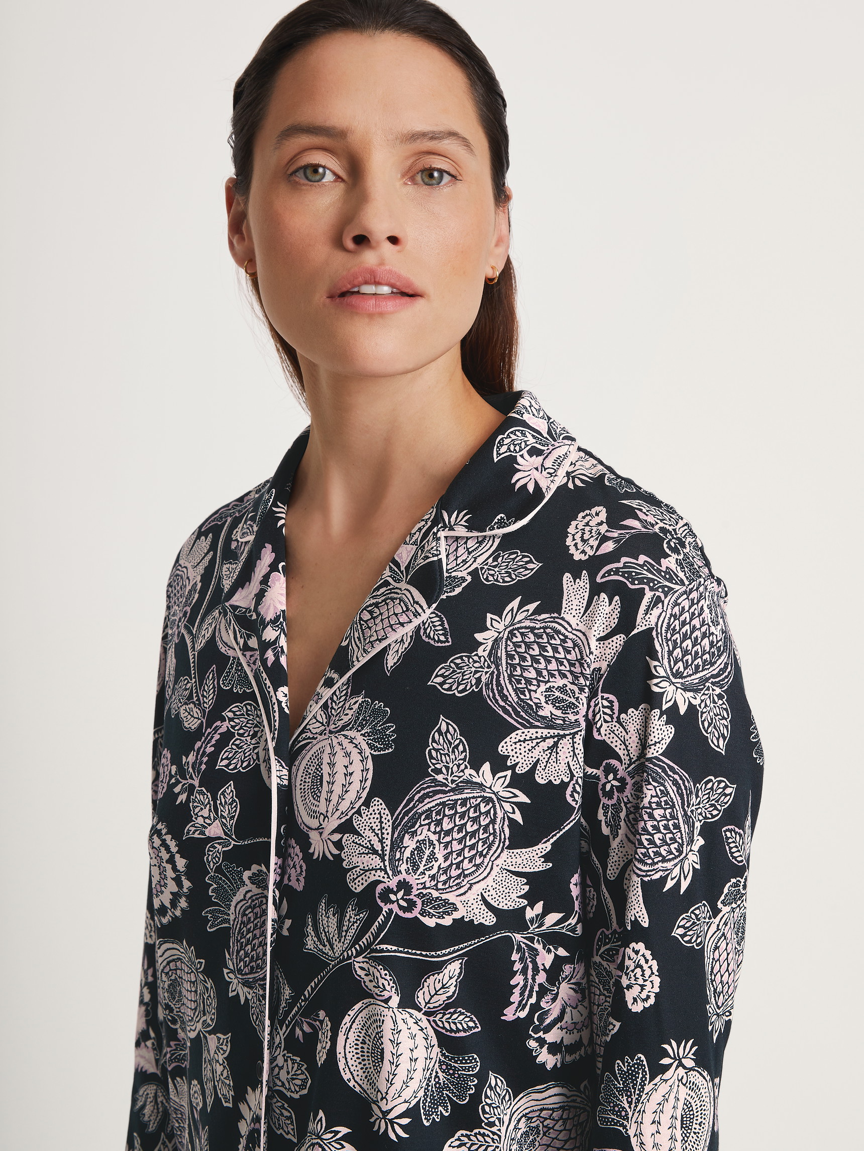 Women model is wearing Long Sleeve Nightdress in TENCEL™ Modal and Silk made of Modal in Black, Floral from the Moonlight Dreams series by CALIDA, Detail