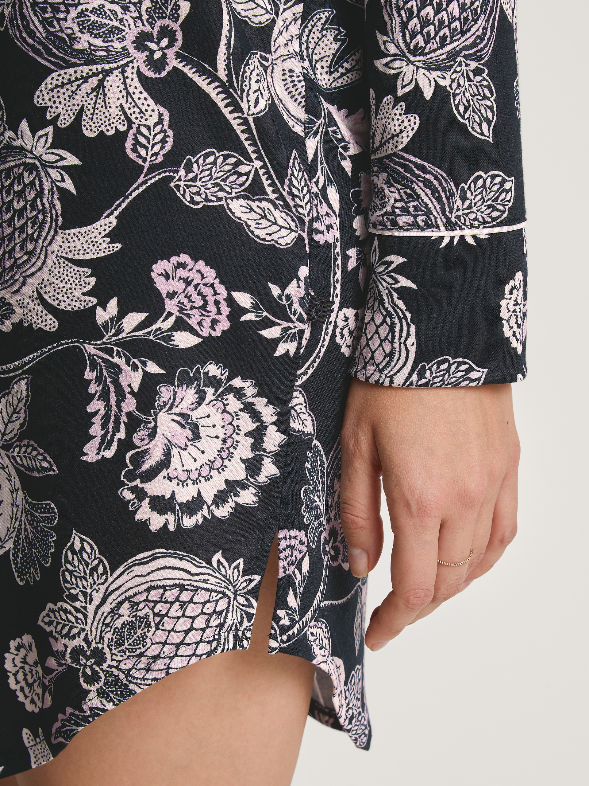 Women model is wearing Long Sleeve Nightdress in TENCEL™ Modal and Silk made of Modal in Black, Floral from the Moonlight Dreams series by CALIDA, Detail