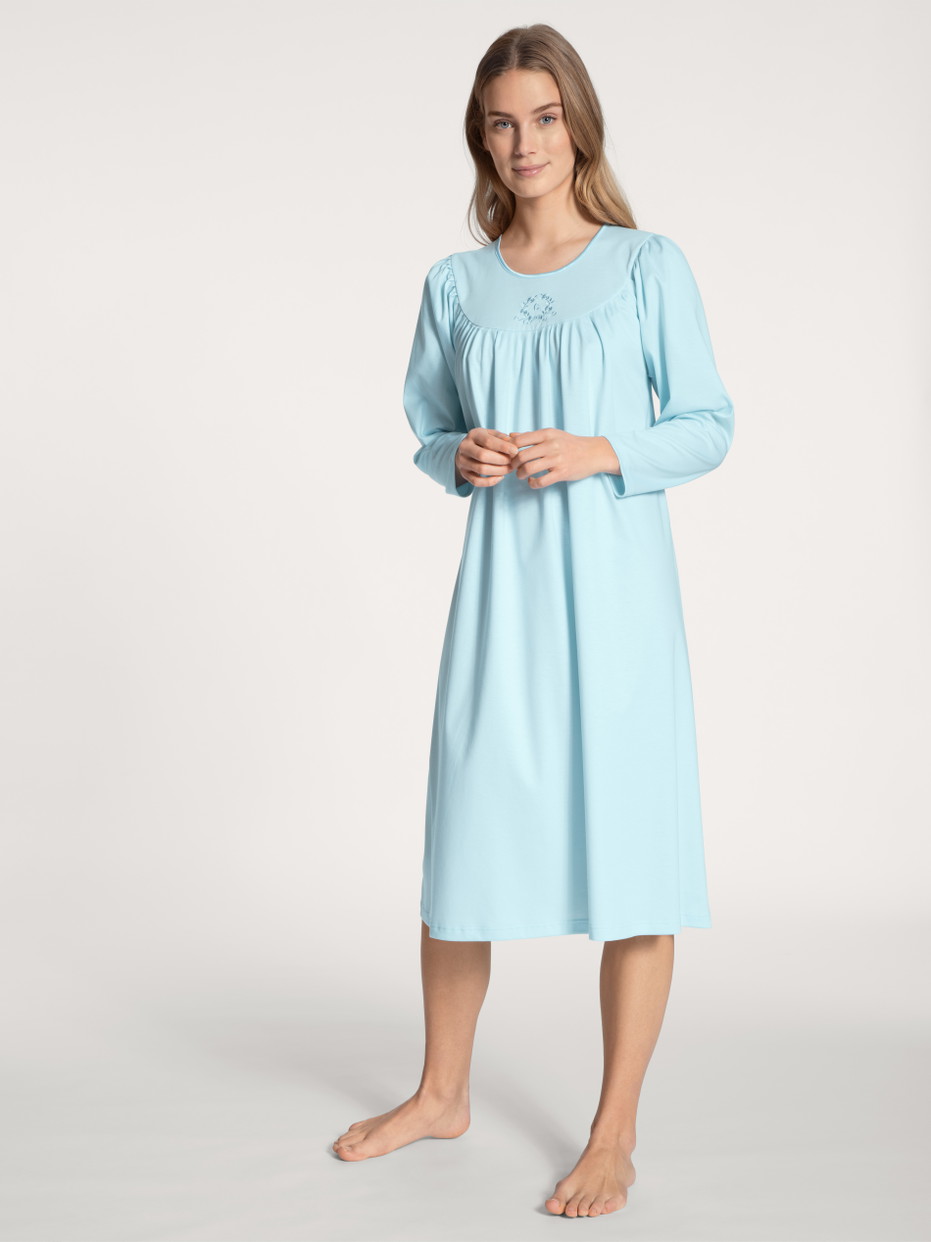 Women model is wearing Nightdress, length 110 cm made of 100% Cotton in Blue, Unicoloured from the Soft Cotton series by CALIDA, Front view