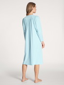 Women model is wearing Nightdress, length 110 cm made of 100% Cotton in Blue, Unicoloured from the Soft Cotton series by CALIDA, Back view