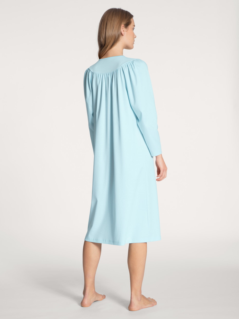 Women model is wearing Nightdress, length 110 cm made of 100% Cotton in Blue, Unicoloured from the Soft Cotton series by CALIDA, Back view