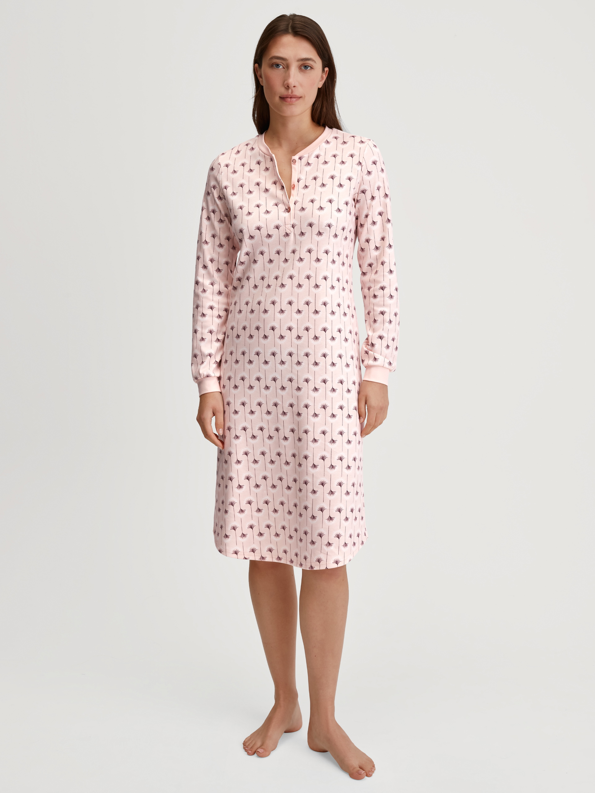 Women model is wearing Long Sleeve Nightdress – 110 cm Length made of 100% Cotton in Pink, Floral from the Midnight Flowers series by CALIDA, Front view