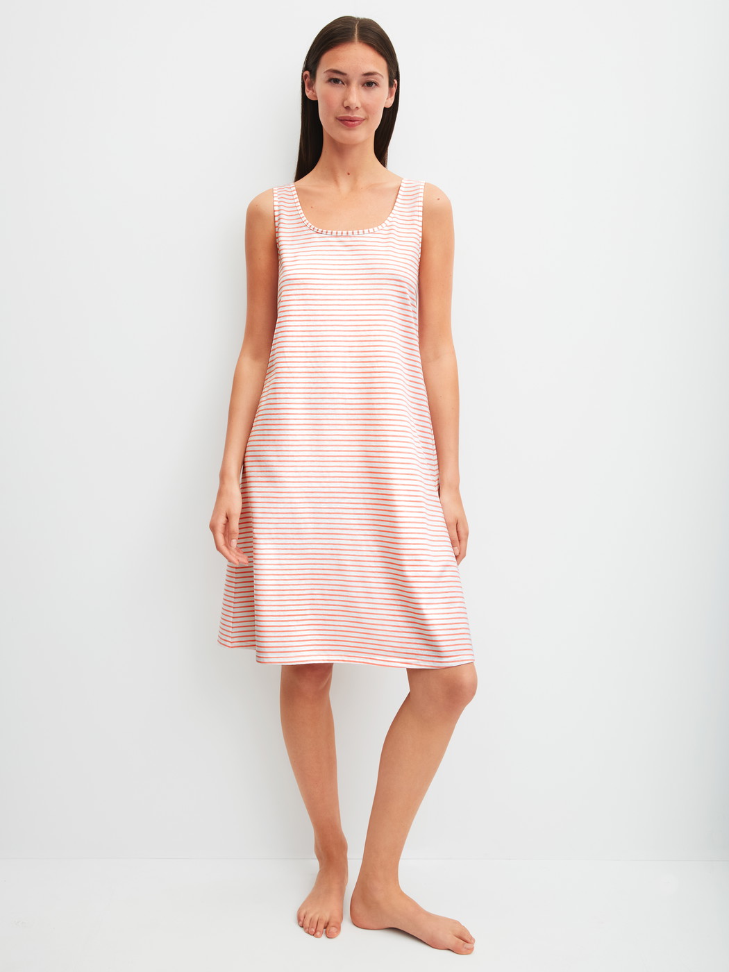 Women model is wearing Nightdress, length 95 cm made of 100% Cotton in Orange, Patterned from the Lovely Nights series by CALIDA, Front view