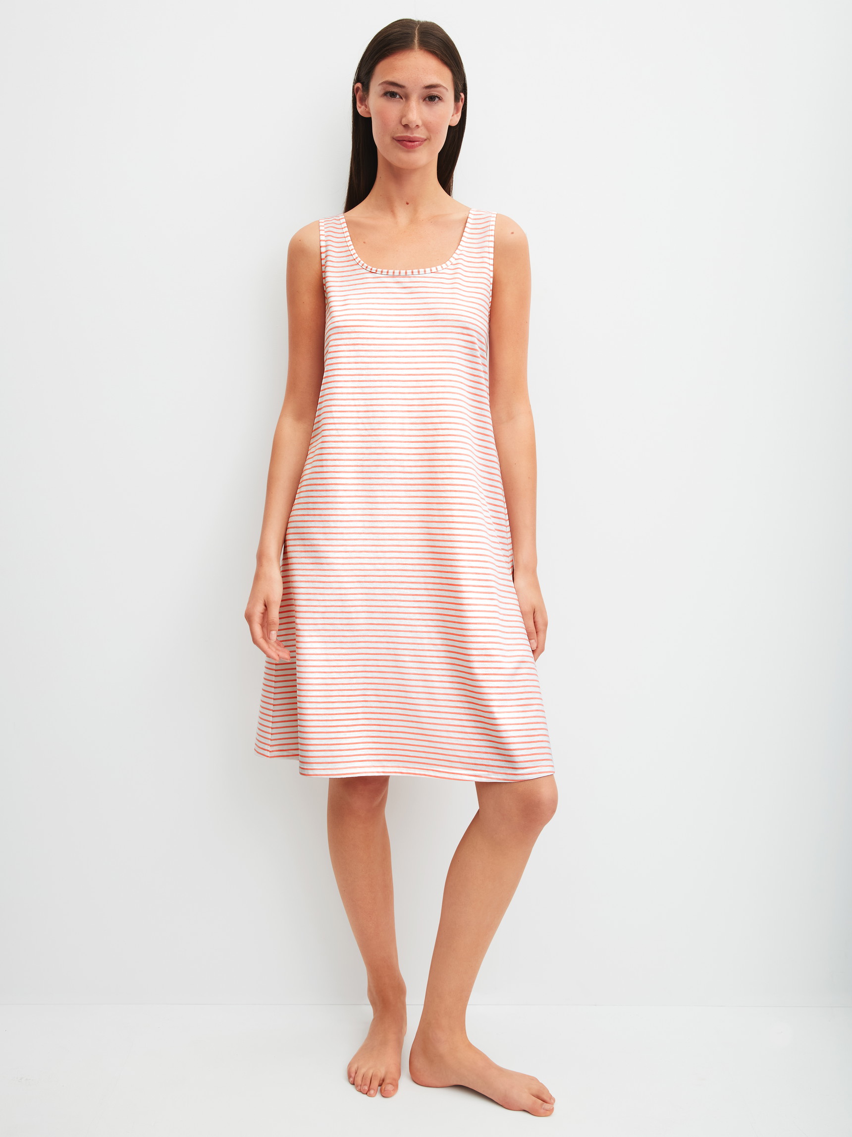 Women model is wearing Nightdress, length 95 cm made of 100% Cotton in Orange, Patterned from the Lovely Nights series by CALIDA, Front view