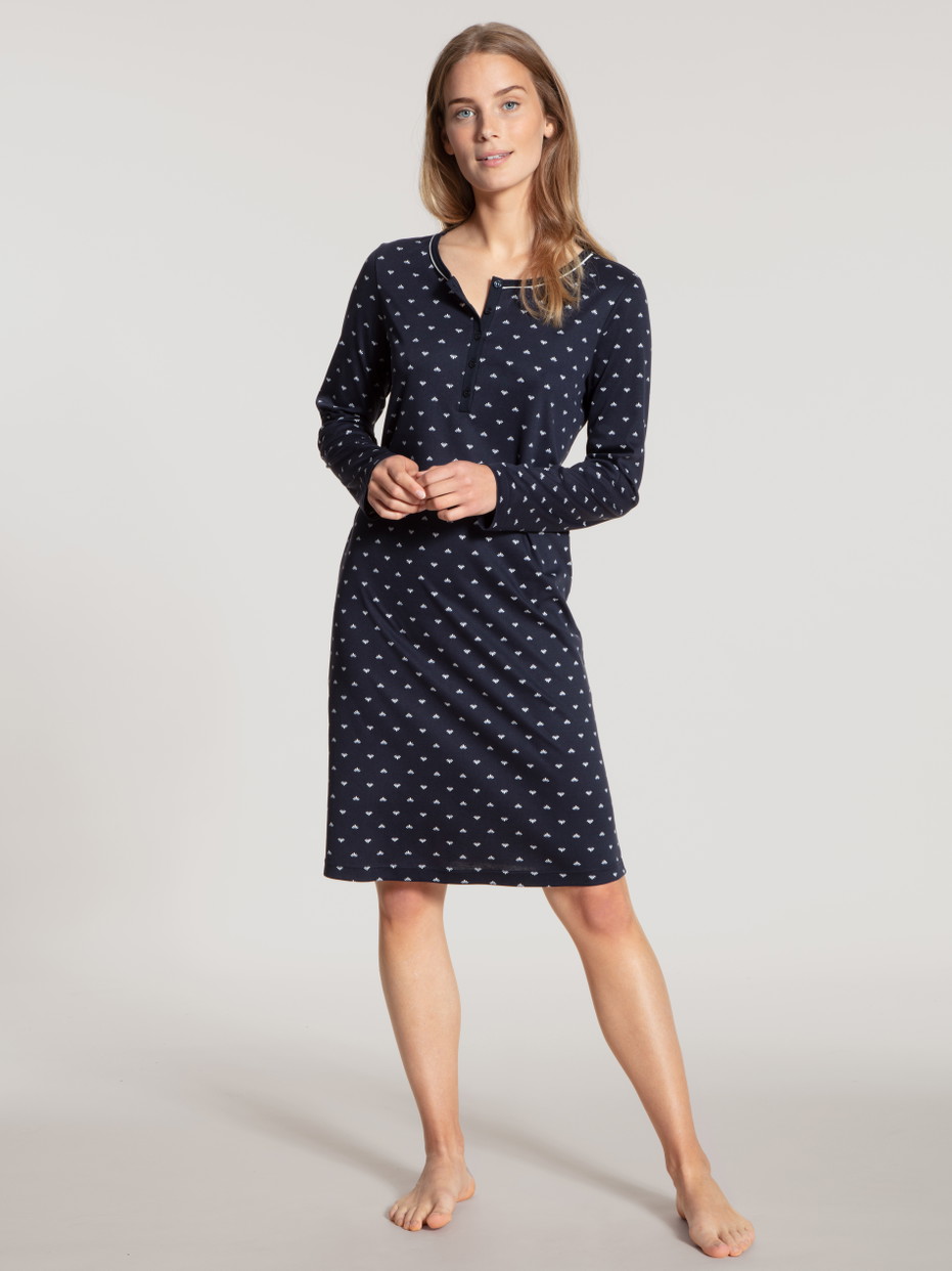 Women model is wearing Sleepshirt, length 100cm made of 100% Cotton in Blue, Motif from the Night Lovers series by CALIDA, Front view