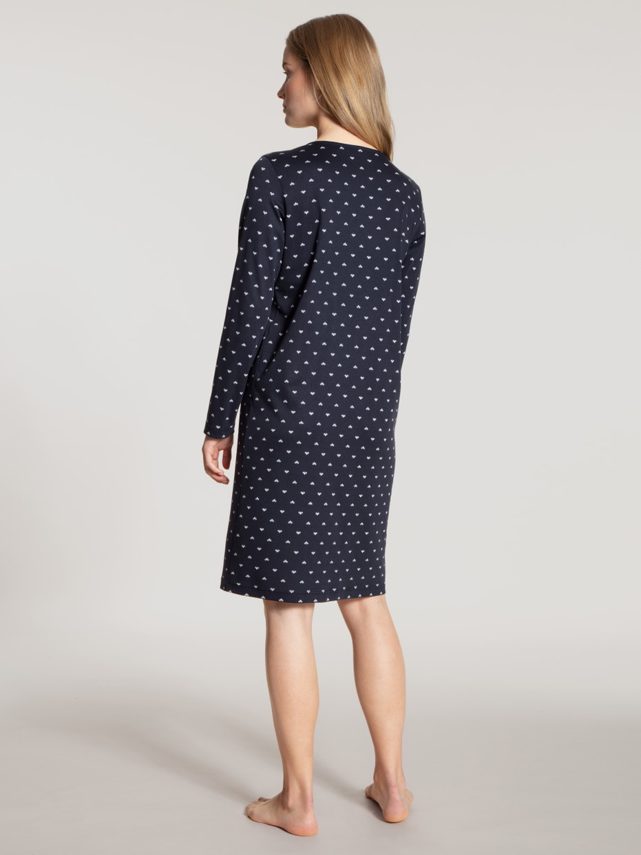 Women model is wearing Sleepshirt, length 100cm made of 100% Cotton in Blue, Motif from the Night Lovers series by CALIDA, Back view