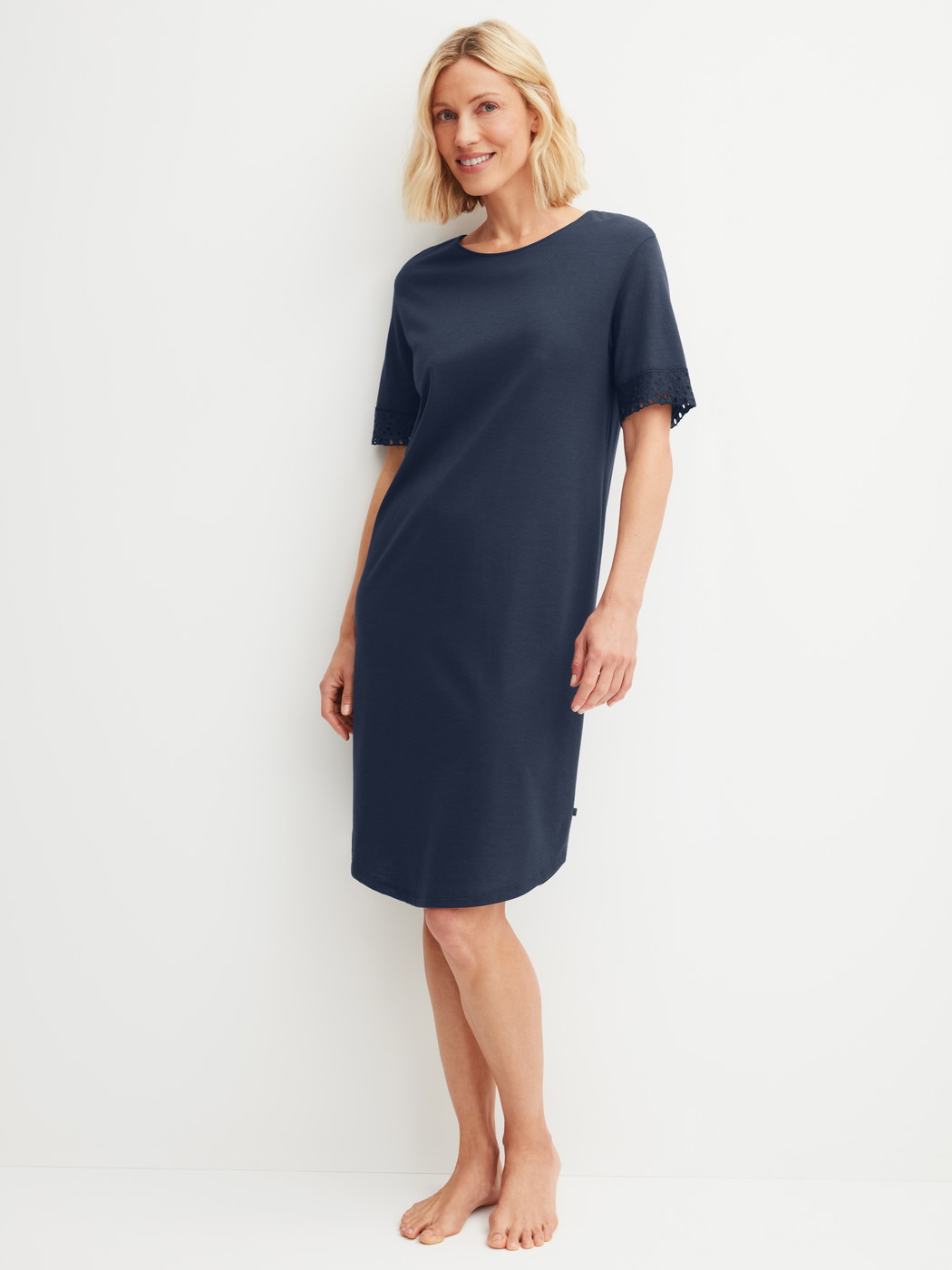 Women model is wearing Short-sleeved nightdress, length 100 cm made of Cotton in Blue, Unicoloured from the Favourites Tiles series by CALIDA, Front view