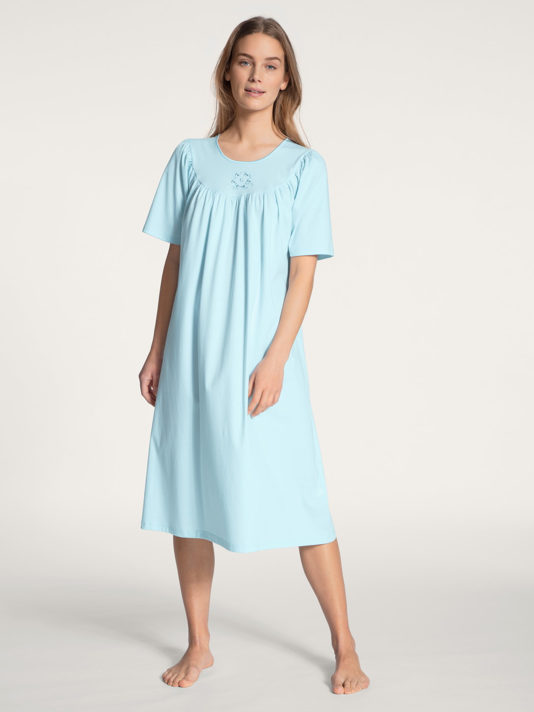 Women model is wearing Nightdress, length 110cm made of 100% Cotton in Blue, Unicoloured from the Soft Cotton series by CALIDA, Front view