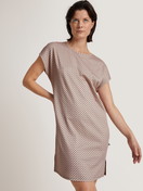 Women model is wearing Sleepshirt, length 90cm made of 100% Cotton in Green, Floral from the Grounded Nights series by CALIDA, Front view