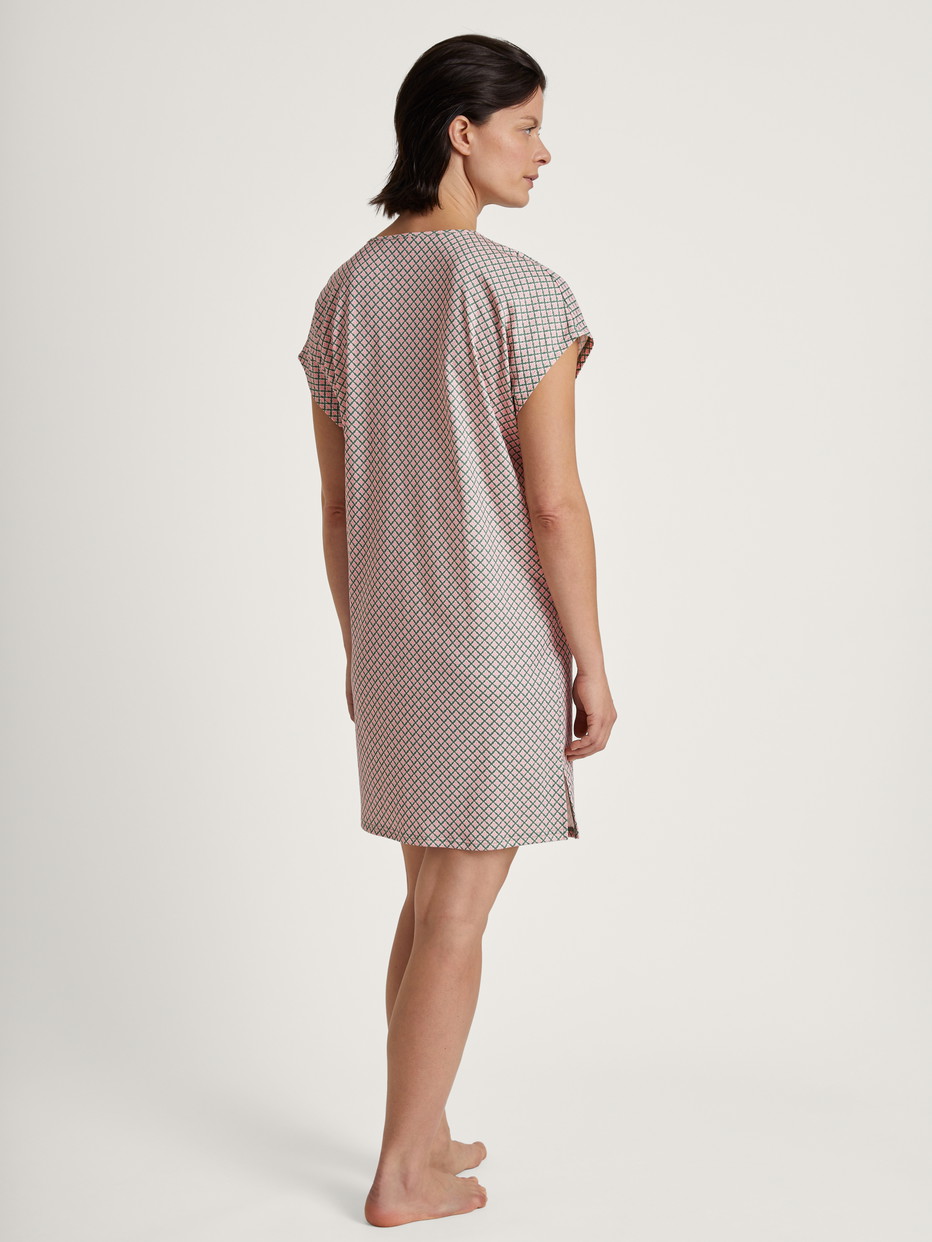 Women model is wearing Sleepshirt, length 90cm made of 100% Cotton in Green, Floral from the Grounded Nights series by CALIDA, Back view