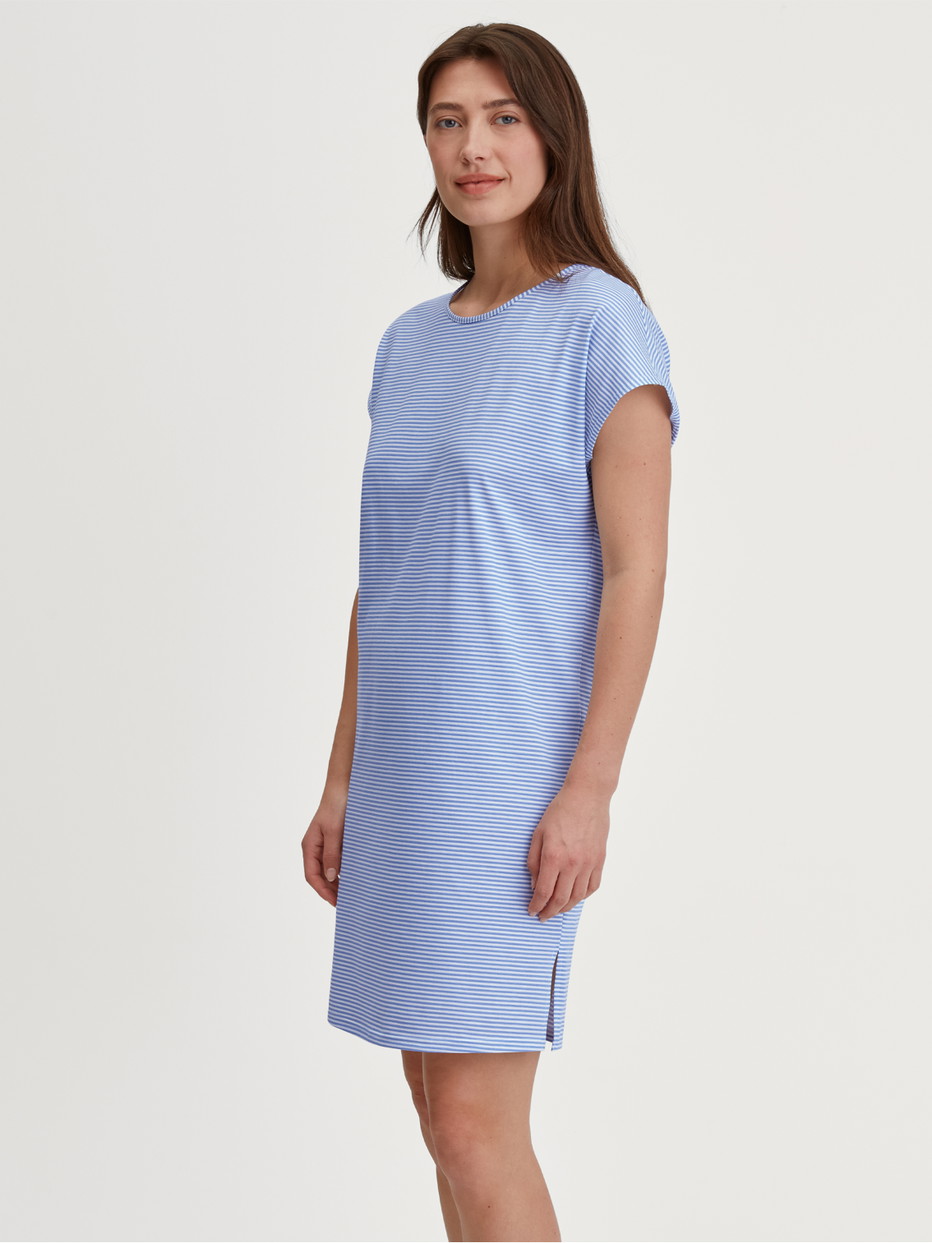 Women model is wearing Short-Sleeve Nightdress – 95 cm Length made of 100% Cotton in Blue, Patterned from the Lovely Nights series by CALIDA, Front view