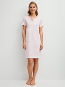 Women model is wearing Short-sleeved nightdress, length 95 cm made of 100% Cotton in Pink, Floral from the Cotton Special series by CALIDA, Front view