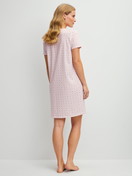 Women model is wearing Short-sleeved nightdress, length 95 cm made of 100% Cotton in Pink, Floral from the Cotton Special series by CALIDA, Back view