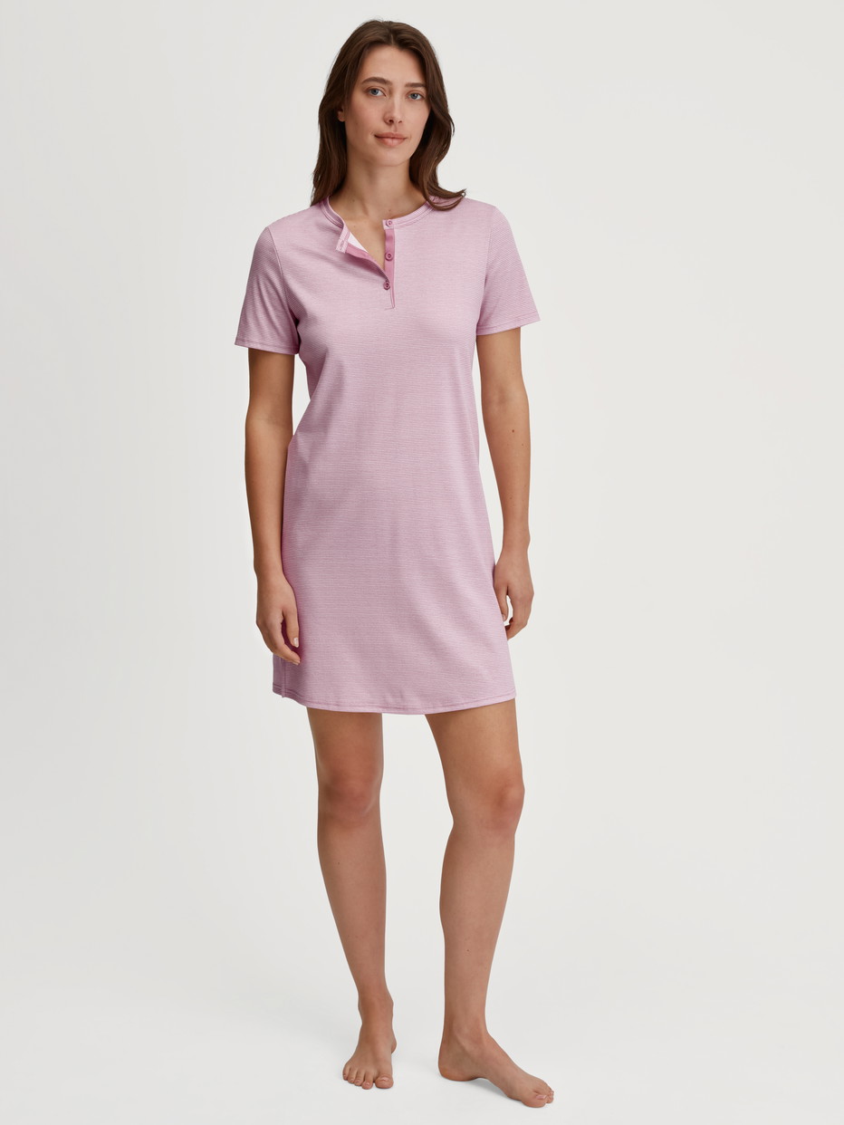 Women model is wearing Sleepshirt, length 90cm made of 100% Cotton in Pink, Striped from the Striped Dreams series by CALIDA, Front view
