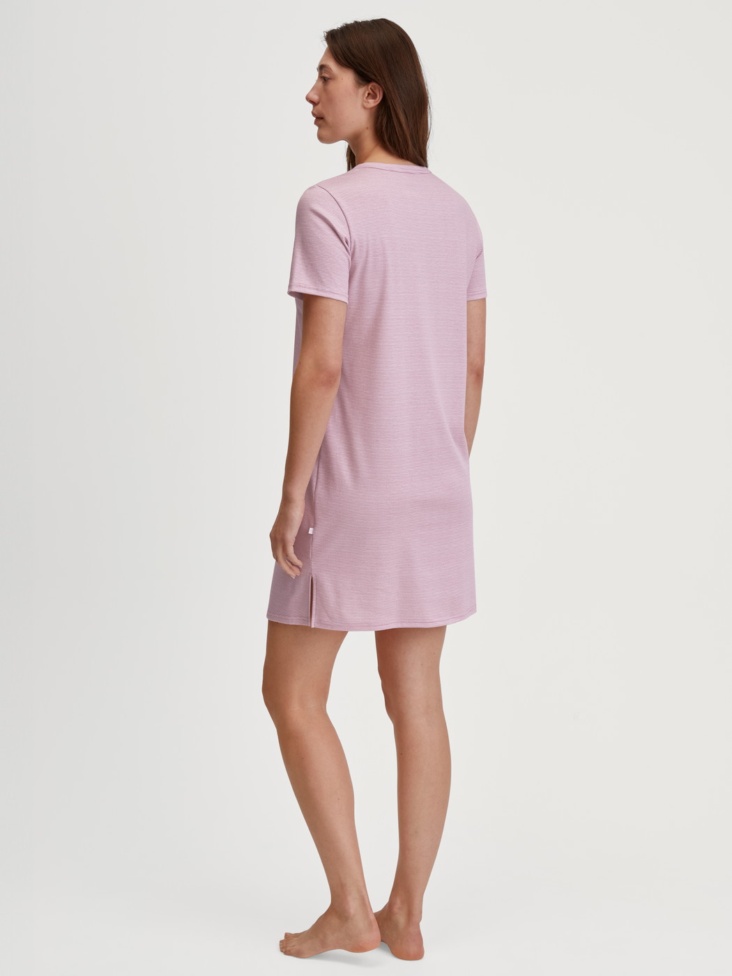 Women model is wearing Sleepshirt, length 90cm made of 100% Cotton in Pink, Striped from the Striped Dreams series by CALIDA, Back view