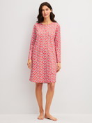 Women model is wearing Long Sleeve Nightdress – 100 cm Length made of 100% Cotton in Red, Patterned from the Fruity Dreams series by CALIDA, Front view