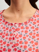 Women model is wearing Long Sleeve Nightdress – 100 cm Length made of 100% Cotton in Red, Patterned from the Fruity Dreams series by CALIDA, Detail