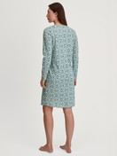 Women model is wearing Long Sleeve Nightdress – 100 cm Length made of 100% Cotton in Blue, Patterned from the Ornament Nights series by CALIDA, Back view
