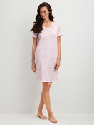 Women model is wearing Sleepshirt, length 95cm made of 100% Cotton in Purple, Patterned from the Blooming Nights series by CALIDA, Front view
