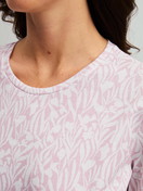 Women model is wearing Long-sleeve nightdress, length 100 cm made of 100% Cotton in Purple, Patterned from the Blooming Nights series by CALIDA, Detail