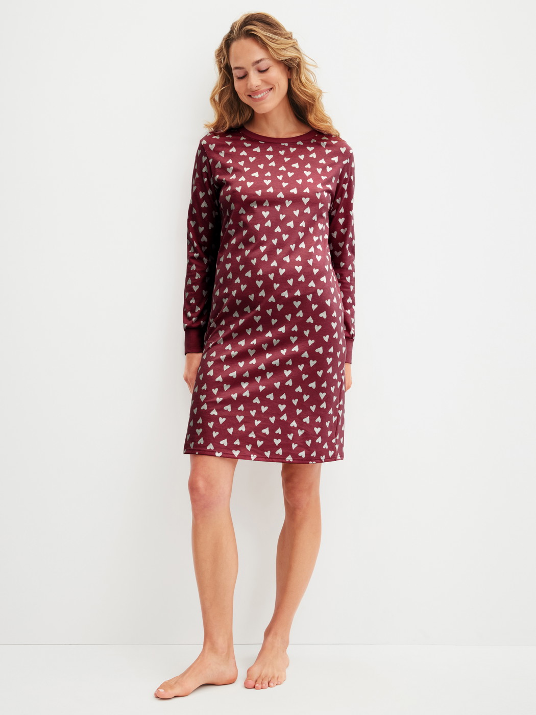 Women model is wearing Long Sleeve Nightdress – 100 cm Length made of 100% Cotton in Red, Patterned from the Cotton Special series by CALIDA, Front view