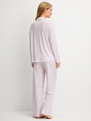 Women model is wearing Pyjamas with buttons made of Modal in Purple, Striped from the Striped Dreams series by CALIDA, Back view