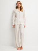 Women model is wearing Pyjamas with buttons made of Modal in Beige, Striped from the Striped Dreams series by CALIDA, Front view