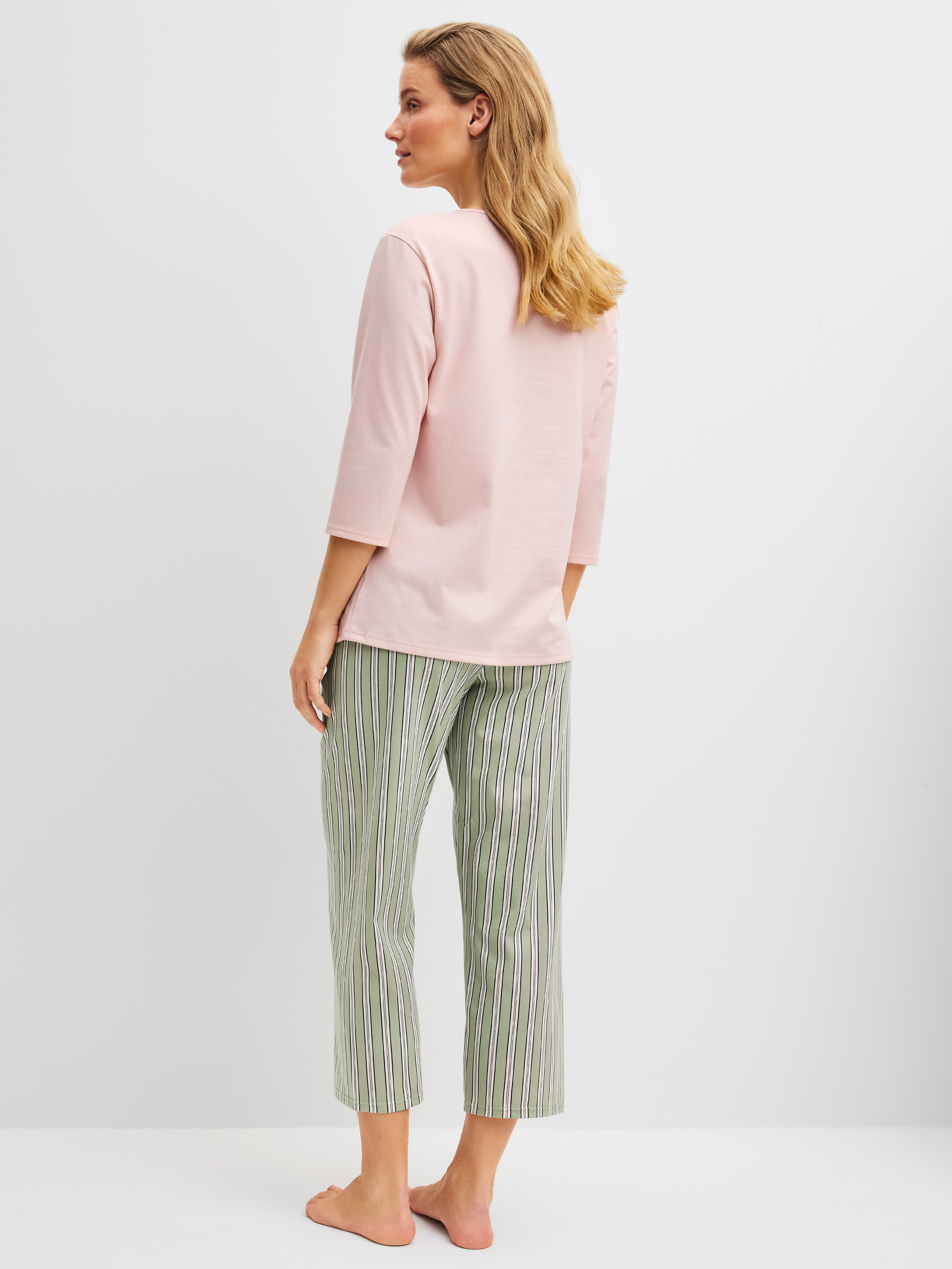 Women model is wearing 7/8 - Pyjamas made of 100% Cotton in Green, Striped from the Cotton Special series by CALIDA, Back view