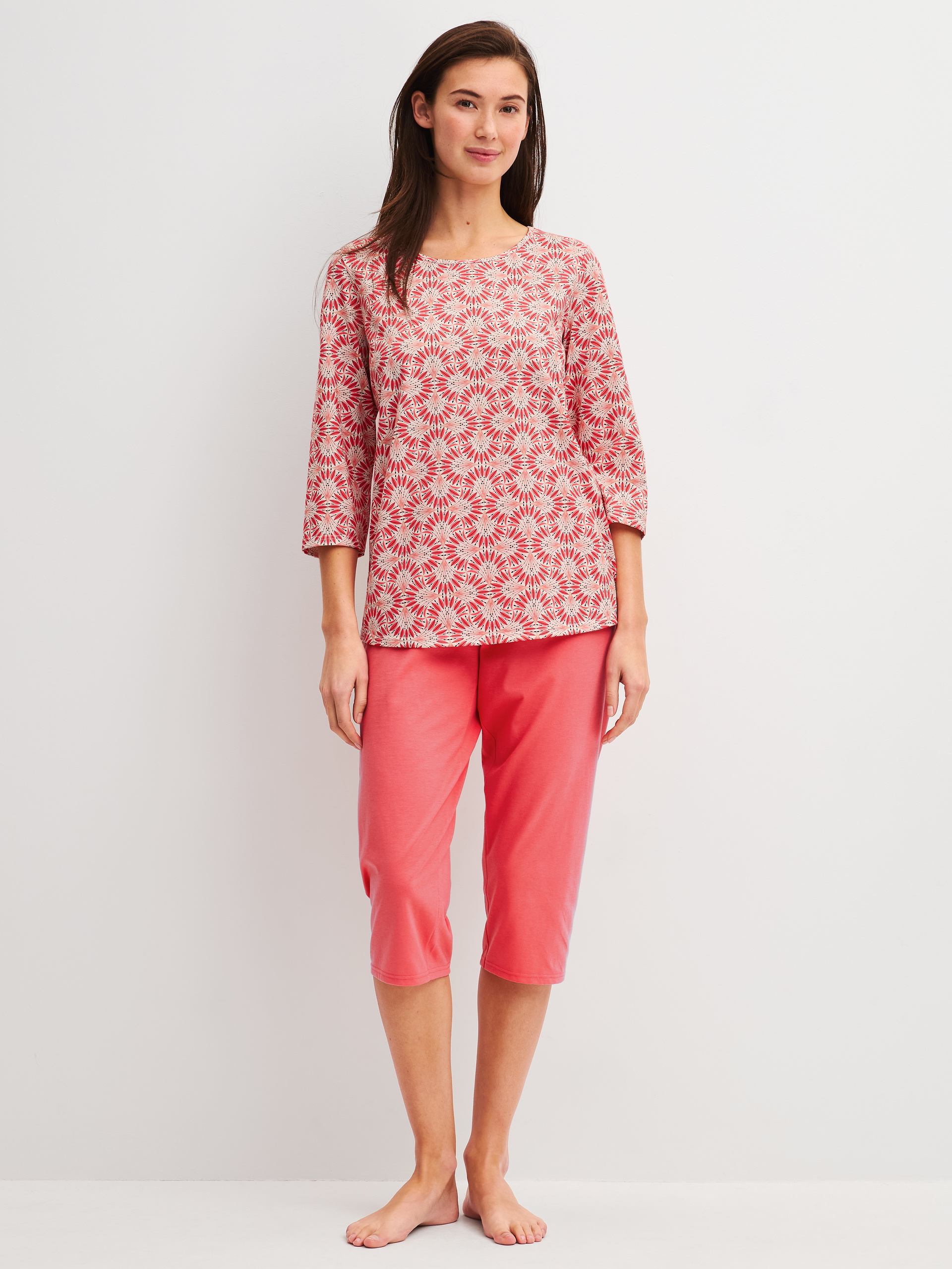 Women model is wearing Capri Pyjama made of 100% Cotton in Red, Patterned from the Cotton Special series by CALIDA, Front view