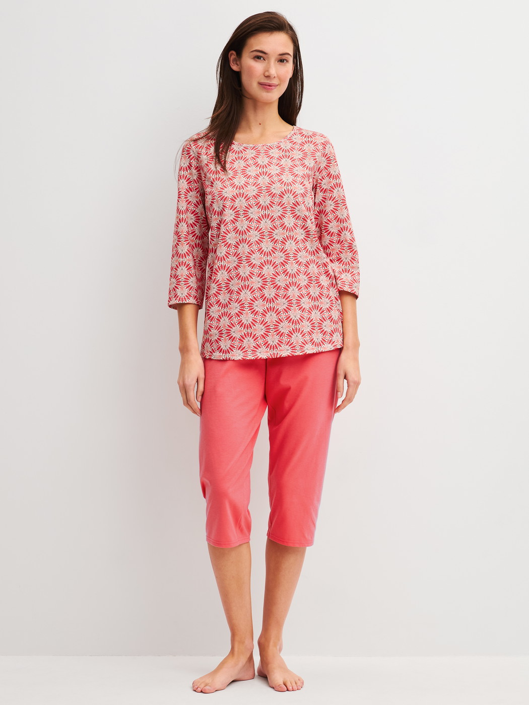 Women model is wearing Capri Pyjama made of 100% Cotton in Red, Patterned from the Cotton Special series by CALIDA, Front view