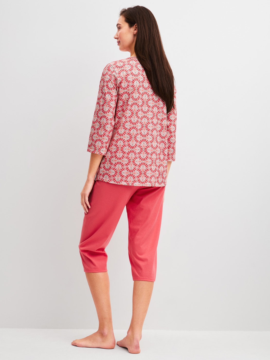 Women model is wearing Capri Pyjama made of 100% Cotton in Red, Patterned from the Cotton Special series by CALIDA, Back view