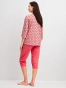 Women model is wearing Capri Pyjama made of 100% Cotton in Red, Patterned from the Cotton Special series by CALIDA, Back view