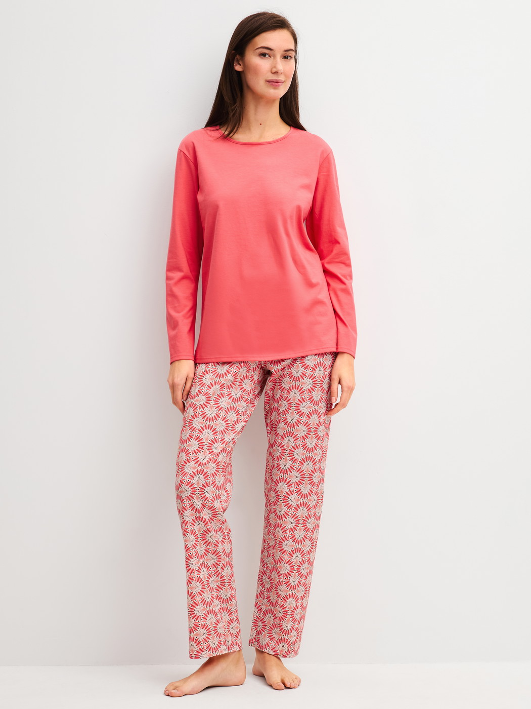 Women model is wearing Pyjamas, long made of 100% Cotton in Red, Patterned from the Cotton Special series by CALIDA, Front view