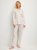 Women model is wearing Button-Up Pyjama made of 100% Cotton in Pink, Floral from the Cotton Special series by CALIDA, Front view