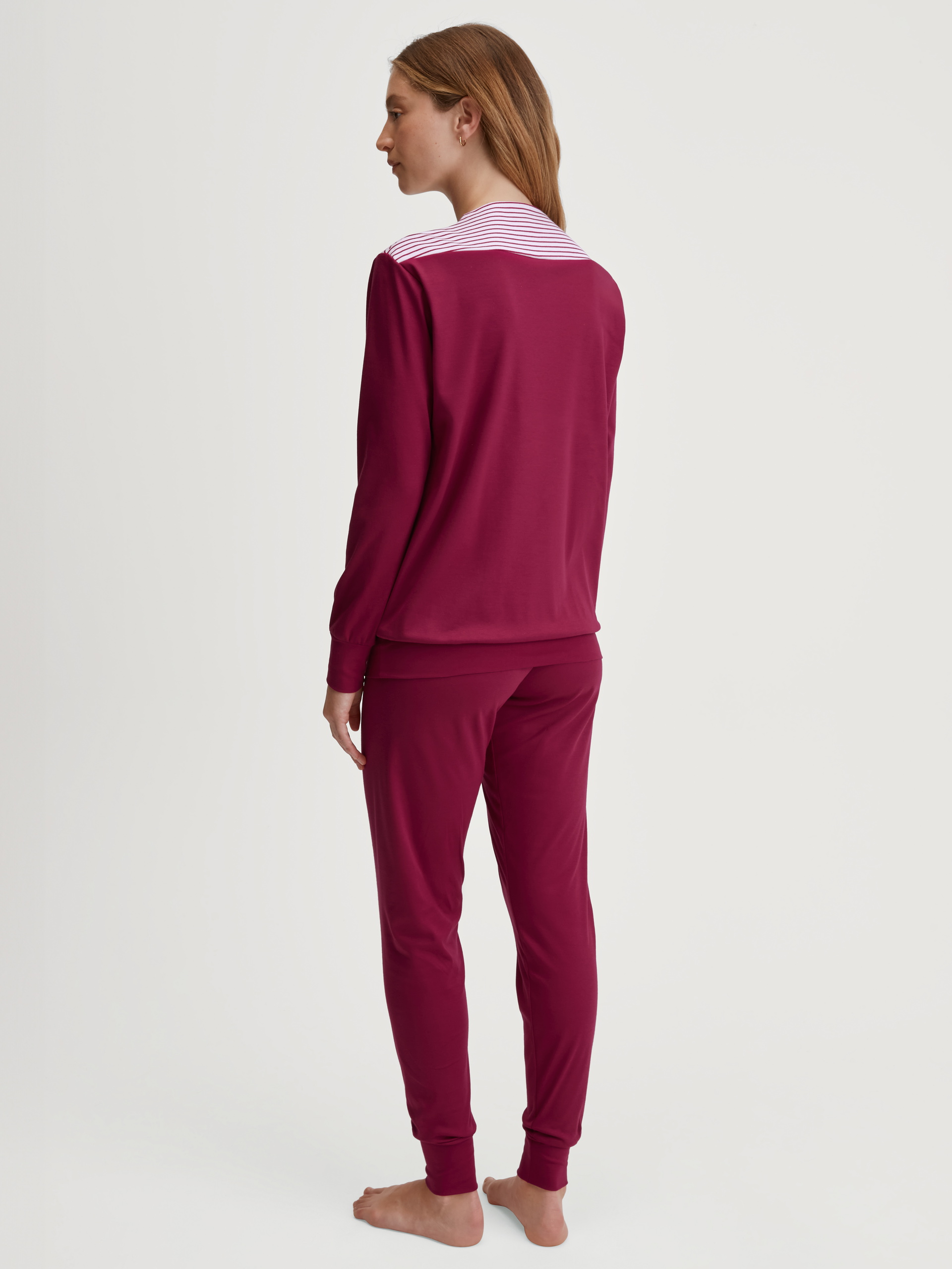 Women model is wearing Pyjama with cuff made of 100% Cotton in Pink, Unicoloured from the Soulmate series by CALIDA, Back view