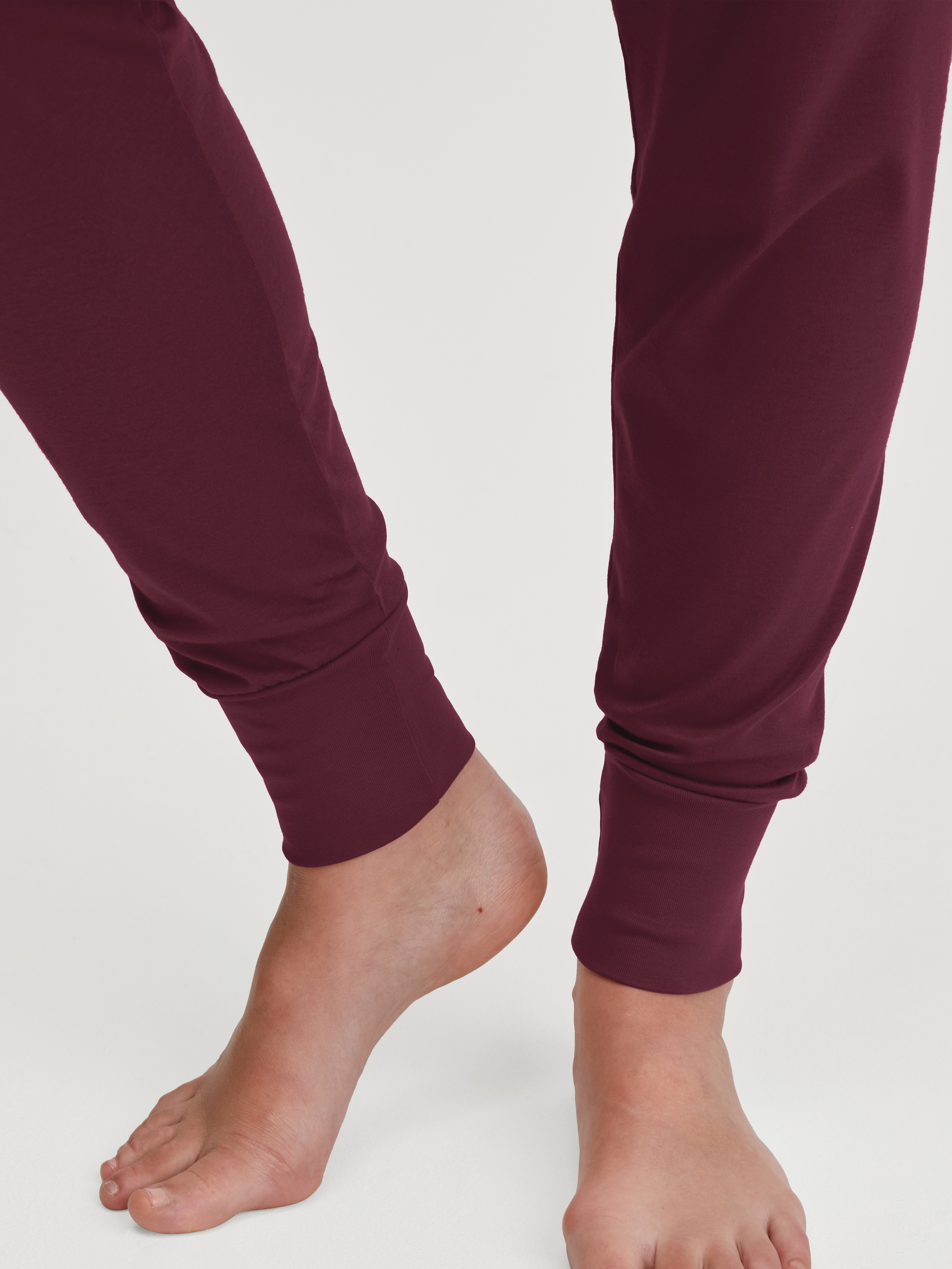 Women model is wearing Pyjama with cuff made of 100% Cotton in Red, Patterned from the Season Special series by CALIDA, Detail