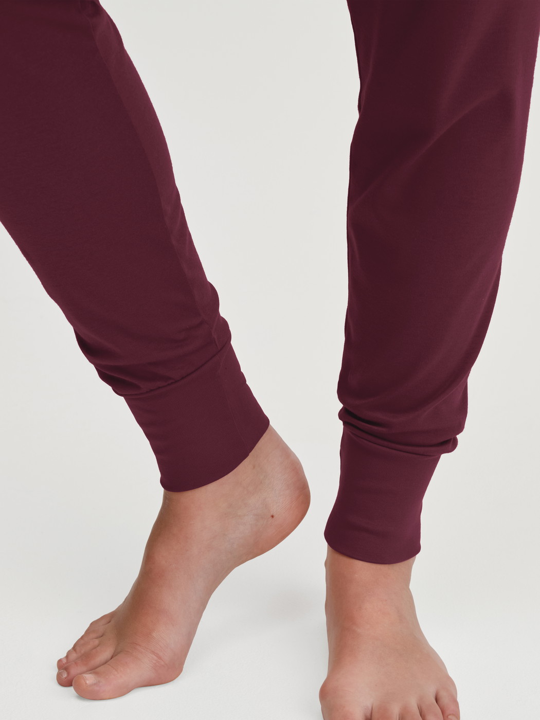 Women model is wearing Pyjama with cuff made of 100% Cotton in Red, Patterned from the Season Special series by CALIDA, Detail