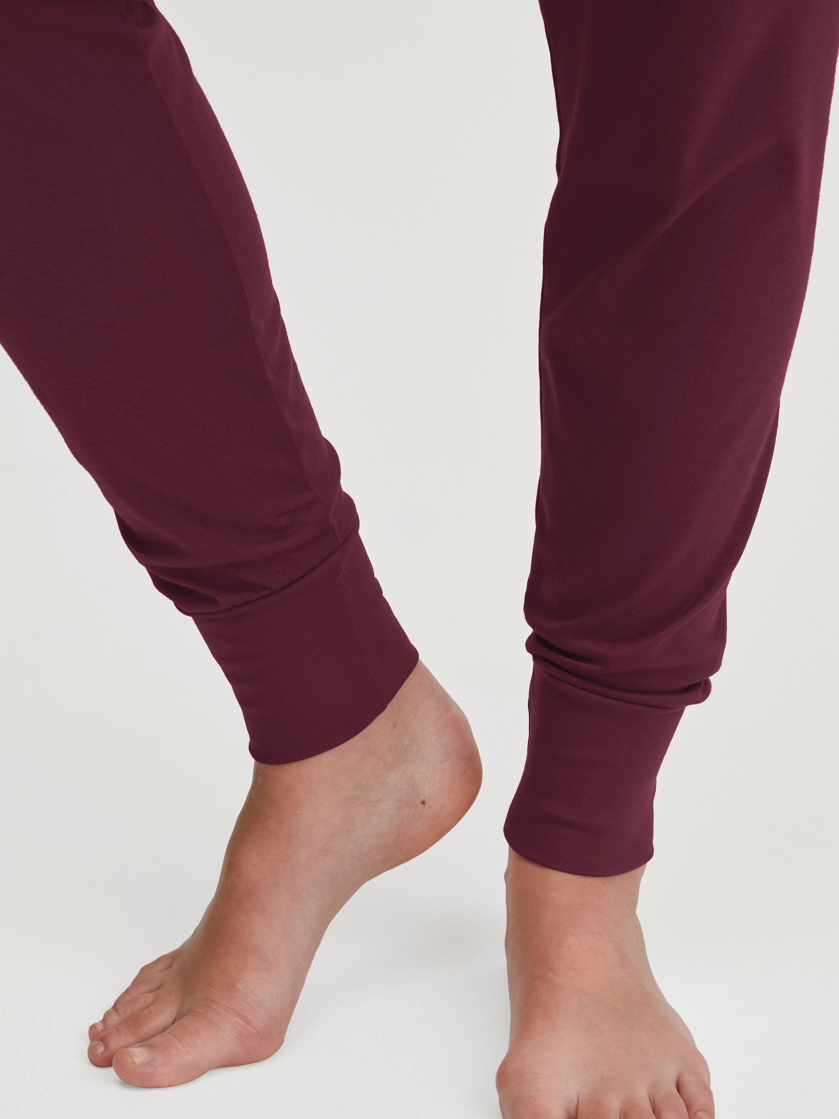 Women model is wearing Pyjama with cuff made of 100% Cotton in Red, Patterned from the Season Special series by CALIDA, Detail