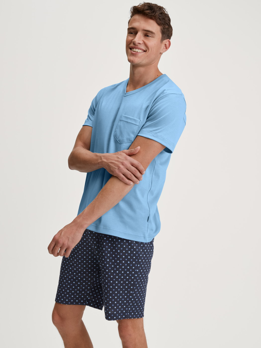 Men model is wearing Short pyjama made of 100% Cotton in Blue, Patterned from the Relax Streamline series by CALIDA, Additional Image