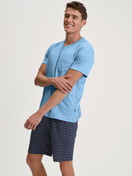 Men model is wearing Short pyjama made of 100% Cotton in Blue, Patterned from the Relax Streamline series by CALIDA, Additional Image