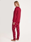 Women model is wearing Pyjamas, long made of 100% Cotton in Red, Motif from the Family & Friends series by CALIDA, Back view