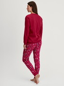 Women model is wearing Pyjama with cuff made of 100% Cotton in Red, Patterned from the Family & Friends series by CALIDA, Back view